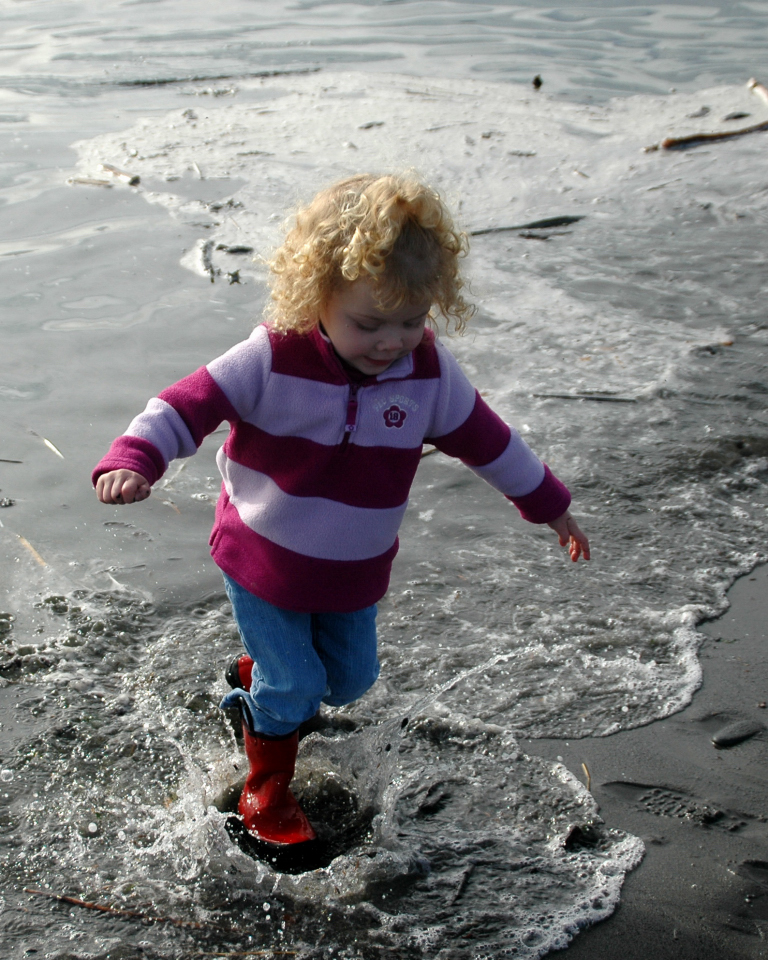Laurel splashing in the ocean